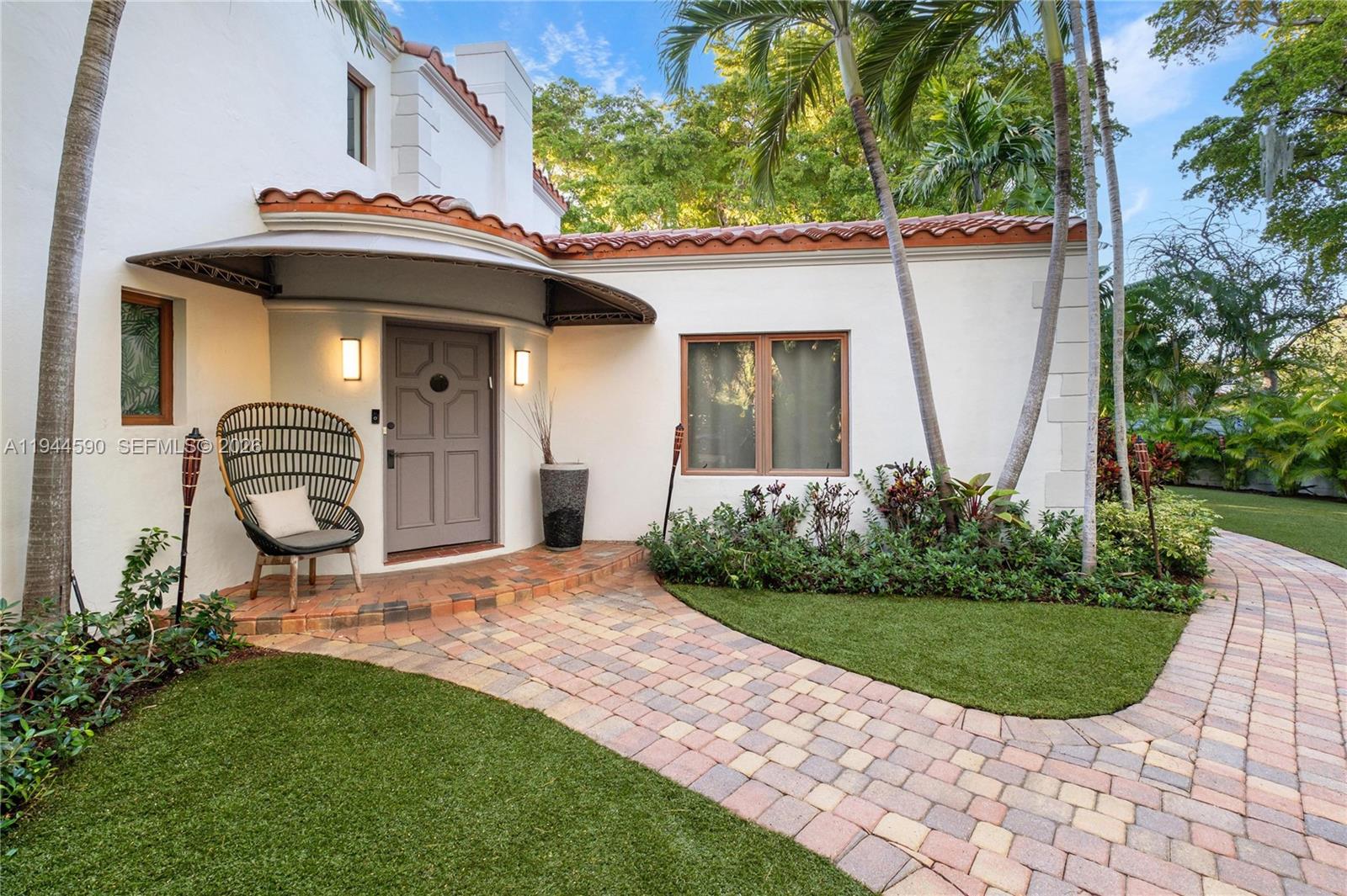 320 West 26th Street Miami Beach, FL 33140 - Photo 30 of 33 a front view of a house with garden
