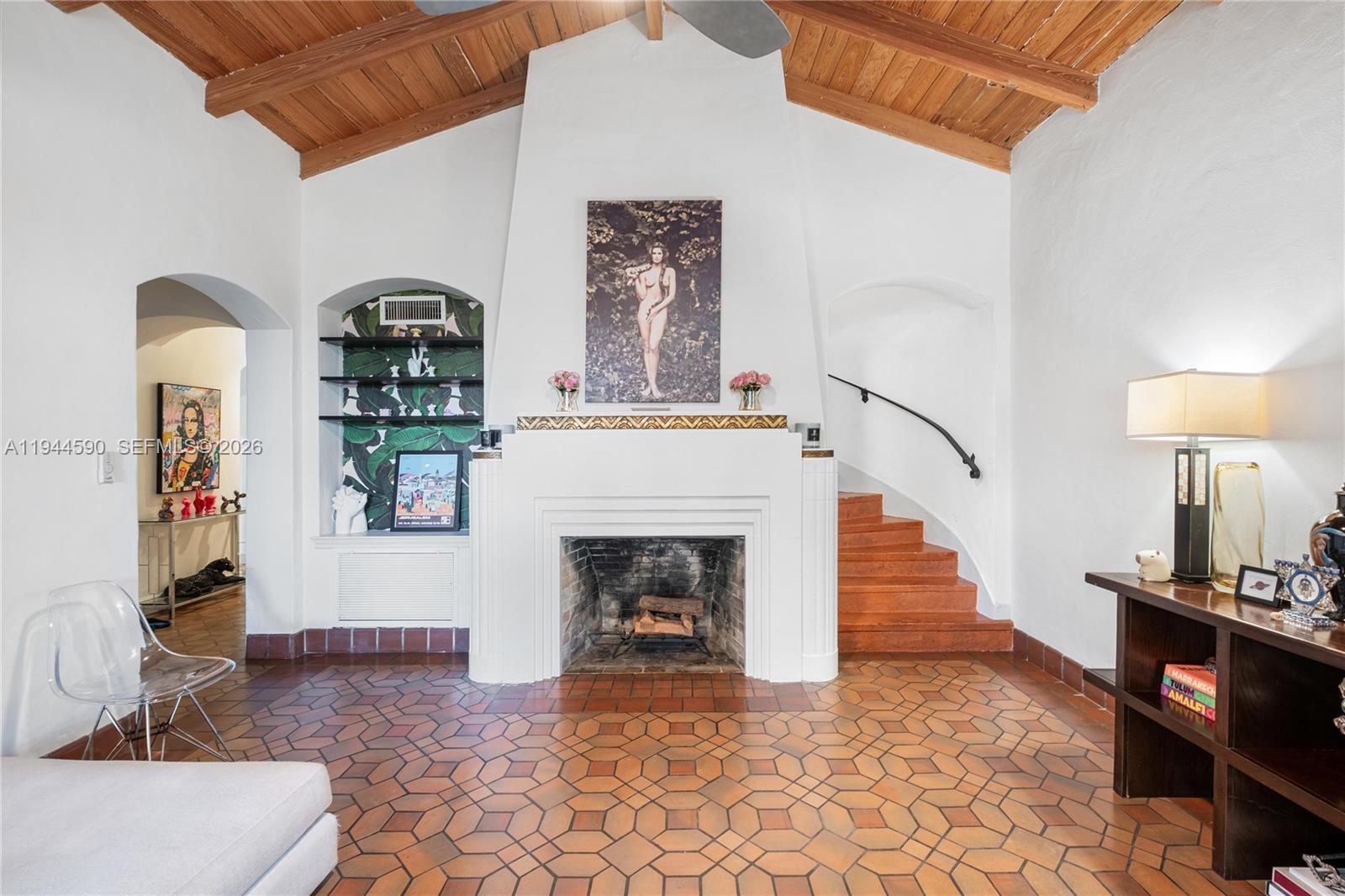 320 West 26th Street Miami Beach, FL 33140 - Photo 4 of 33 a living room with furniture and a fireplace