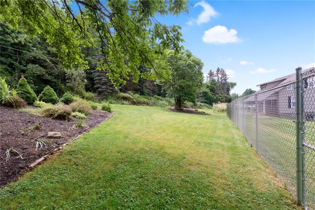101 Unionville Road Freedom, PA 15042 - Photo 20 of 25 Professionally landscaped yard, with a large fenced in area.