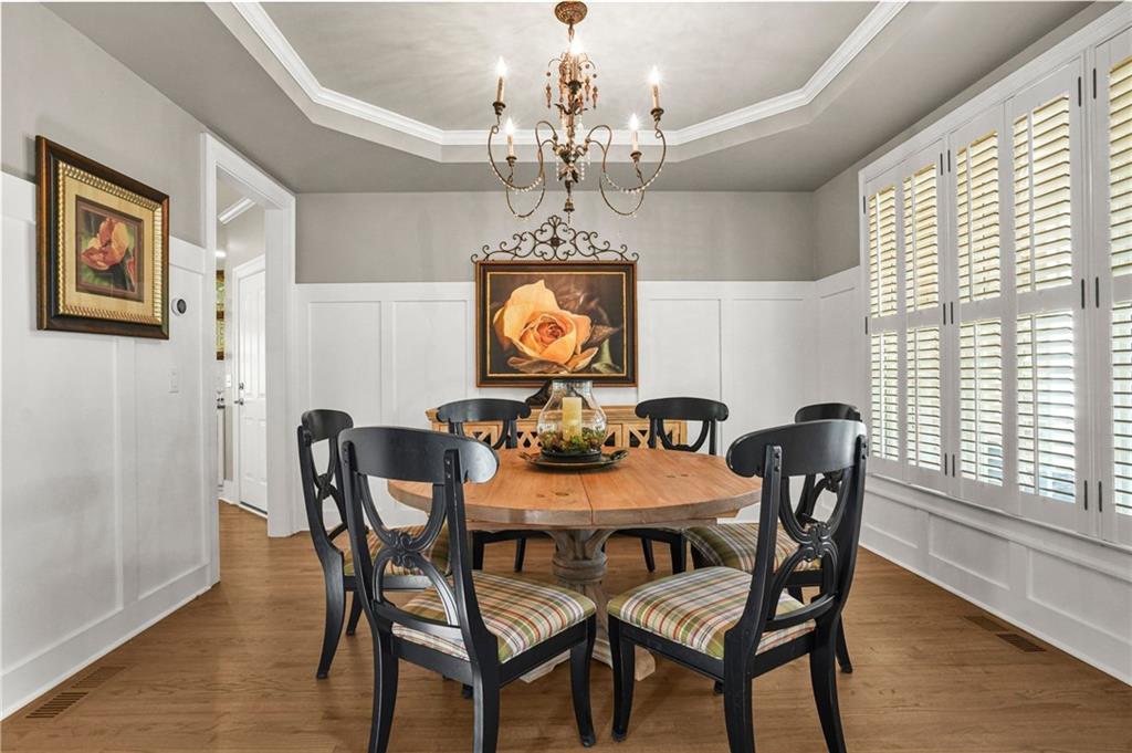 509 Crested Hawk Ridge Canton, GA 30114 - Photo 10 of 89 a view of a dining room with furniture window and wooden floor