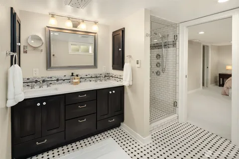 a utility room with sink dryer and washer