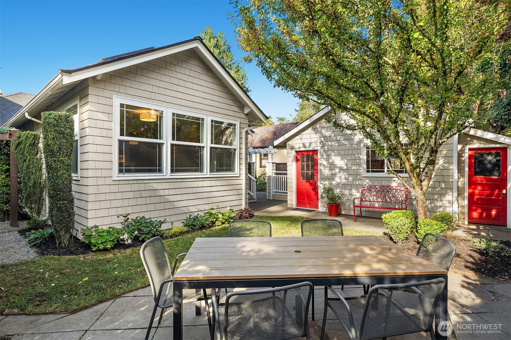 6838 30th Avenue Northeast Seattle, WA 98115 - Photo 24 of 34 a view of a house with backyard and sitting area