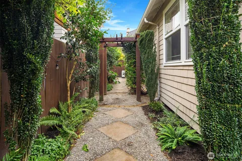 an aerial view of a house with a yard swimming pool and outdoor seating