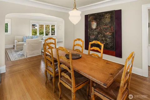 a large kitchen with lots of counter space and wooden floor