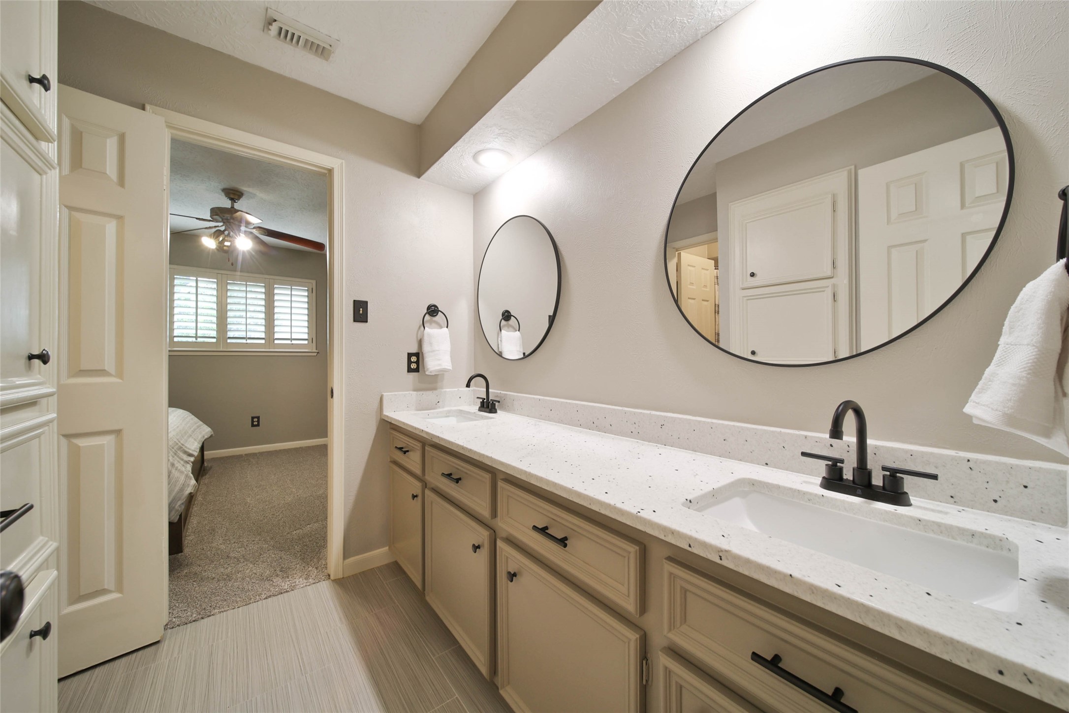 17007 Windrow Drive Spring, TX 77379 - Photo 31 of 46 a bathroom with a double vanity sink and a mirror