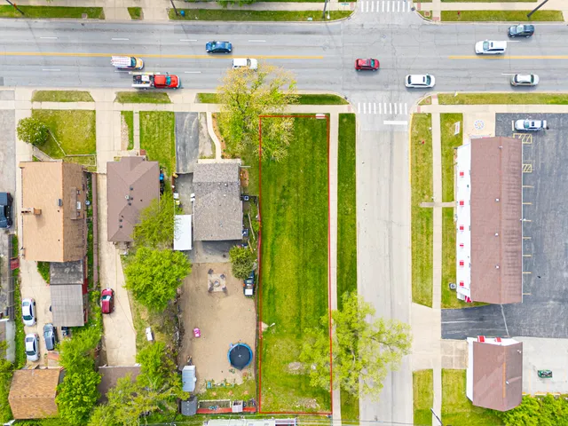a front view of multi story residential apartment building with yard