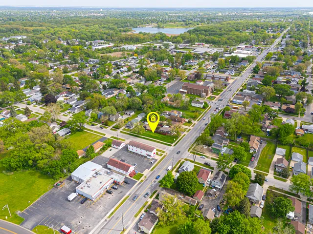 an aerial view of residential houses with outdoor space