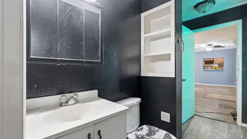 10565 Bessemer Street New Port Richey, FL 34654 - Photo 67 of 72 a bathroom with a sink a toilet and shower