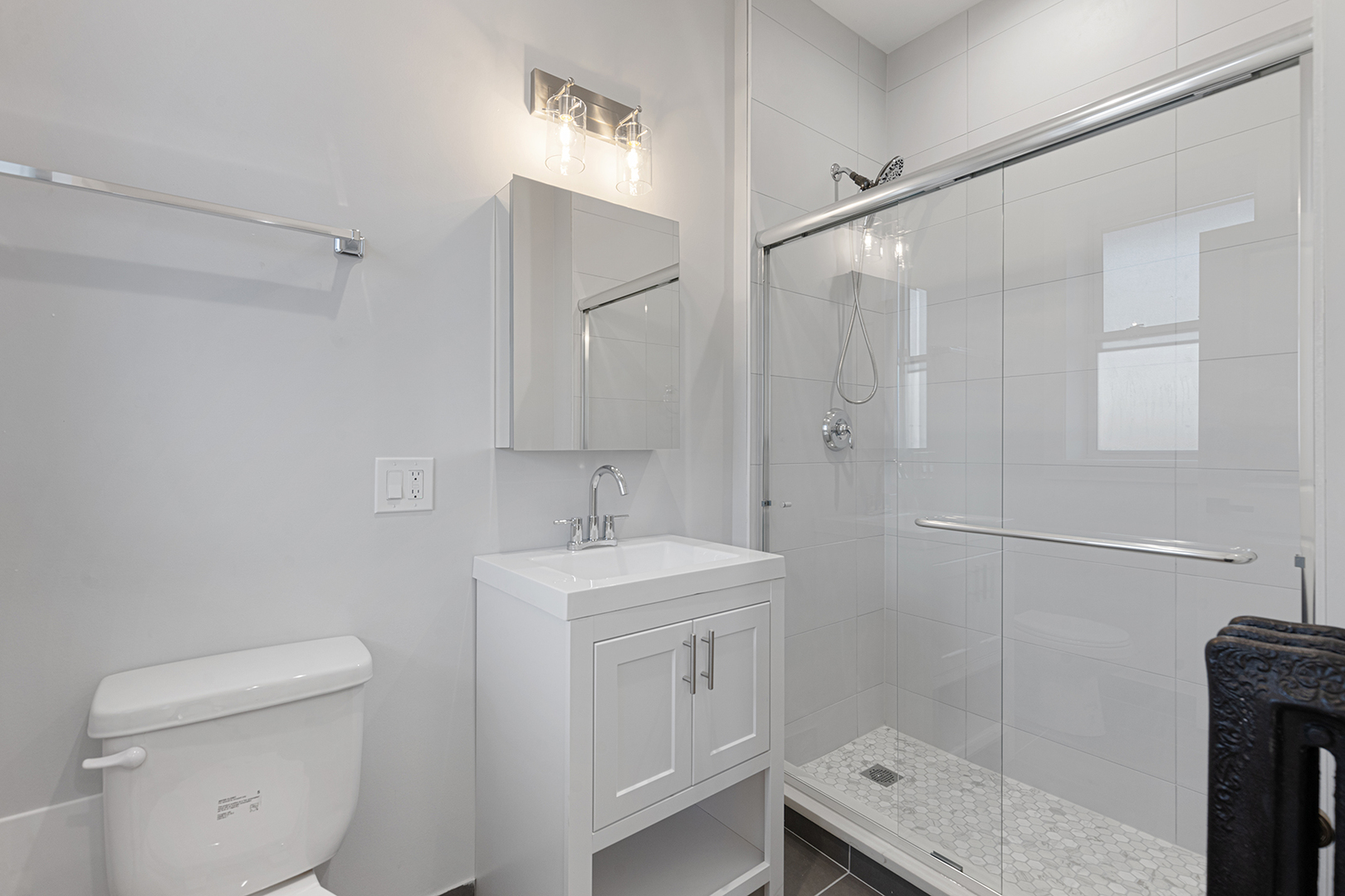 7423 North Clark Street, Unit 2 Chicago, IL 60626 - Photo 11 of 13 a bathroom with a sink a toilet and shower