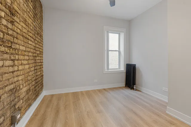 a view of an empty room and a window
