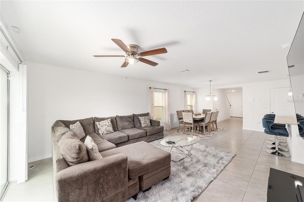 8696 Southwest 46th Avenue Ocala, FL 34476 - Photo 11 of 51 a living room with furniture and wooden floor