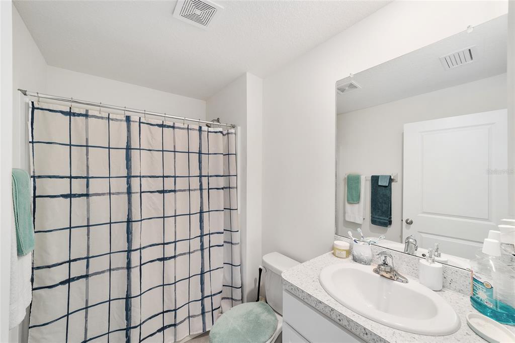 8696 Southwest 46th Avenue Ocala, FL 34476 - Photo 23 of 51 a bathroom with a sink shower and a mirror