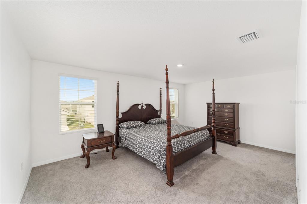 8696 Southwest 46th Avenue Ocala, FL 34476 - Photo 26 of 51 a bed room with furniture and a window