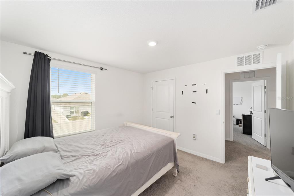 8696 Southwest 46th Avenue Ocala, FL 34476 - Photo 32 of 51 a bedroom with a bed and a window