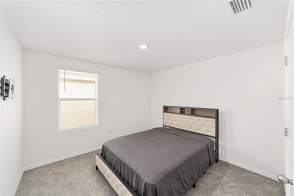 8696 Southwest 46th Avenue Ocala, FL 34476 - Photo 34 of 51 a bedroom with a bed and window