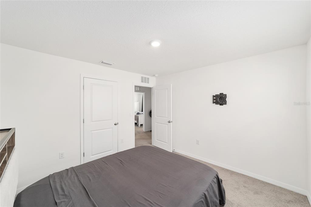 8696 Southwest 46th Avenue Ocala, FL 34476 - Photo 35 of 51 a view of a room that has a bed in it