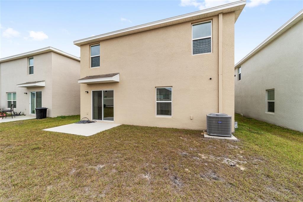 8696 Southwest 46th Avenue Ocala, FL 34476 - Photo 39 of 51 a view of a house with a backyard