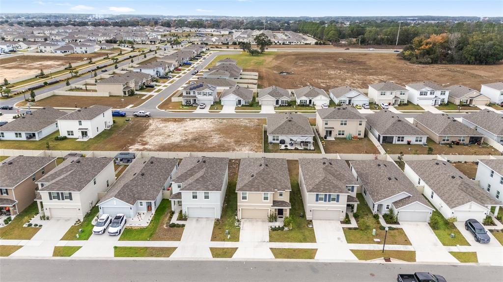 8696 Southwest 46th Avenue Ocala, FL 34476 - Photo 42 of 51 an aerial view of residential houses with outdoor space