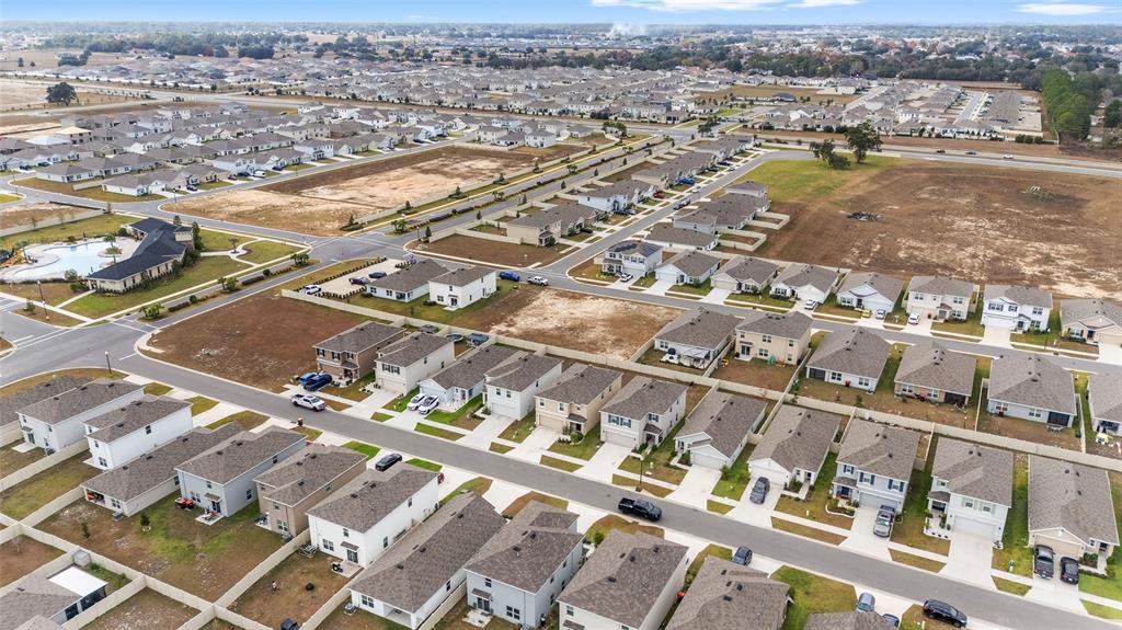 8696 Southwest 46th Avenue Ocala, FL 34476 - Photo 43 of 51 an aerial view of residential houses with outdoor space