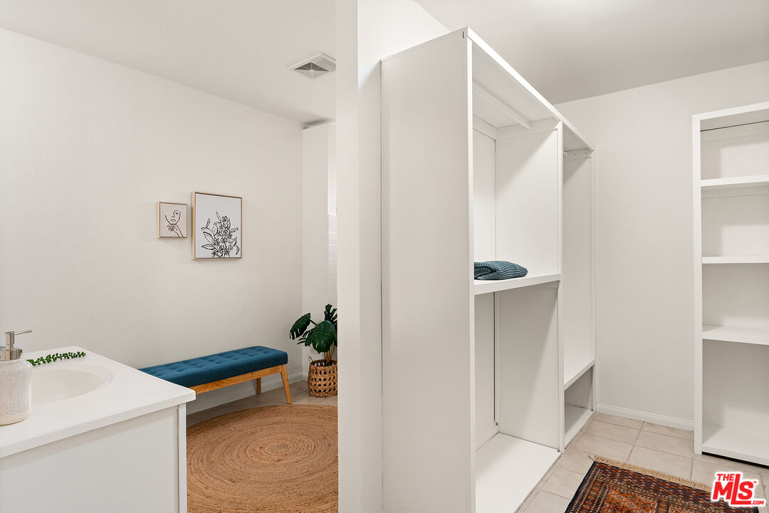4014 Baywood Street Los Angeles, CA 90039 - Photo 15 of 25 a bathroom with a sink a mirror and a shower