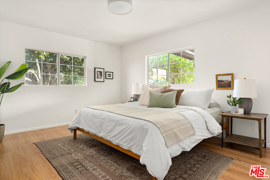 4014 Baywood Street Los Angeles, CA 90039 - Photo 18 of 25 a bedroom with a bed and wooden floor