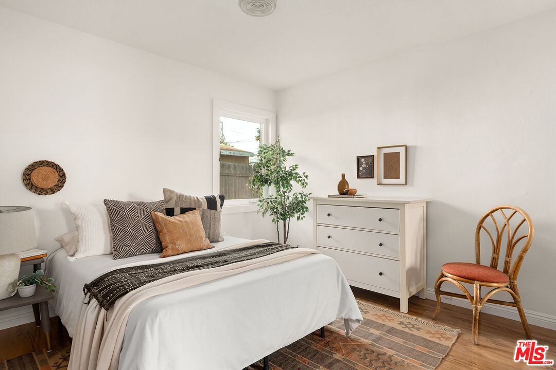 4014 Baywood Street Los Angeles, CA 90039 - Photo 10 of 25 a bedroom with a bed and a chair