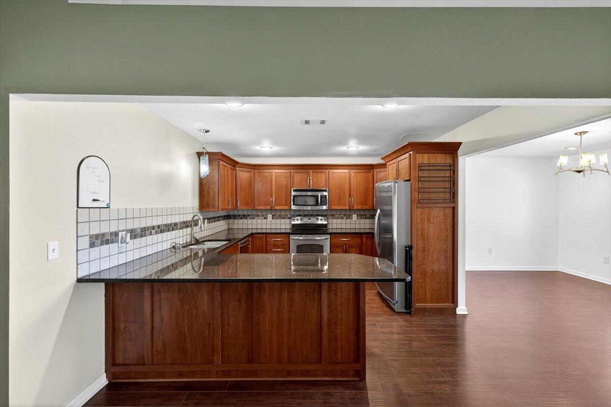 608 Northview Drive Crestview, FL 32536 - Photo 12 of 39 a kitchen with kitchen island a counter top space a sink stainless steel appliances and cabinets