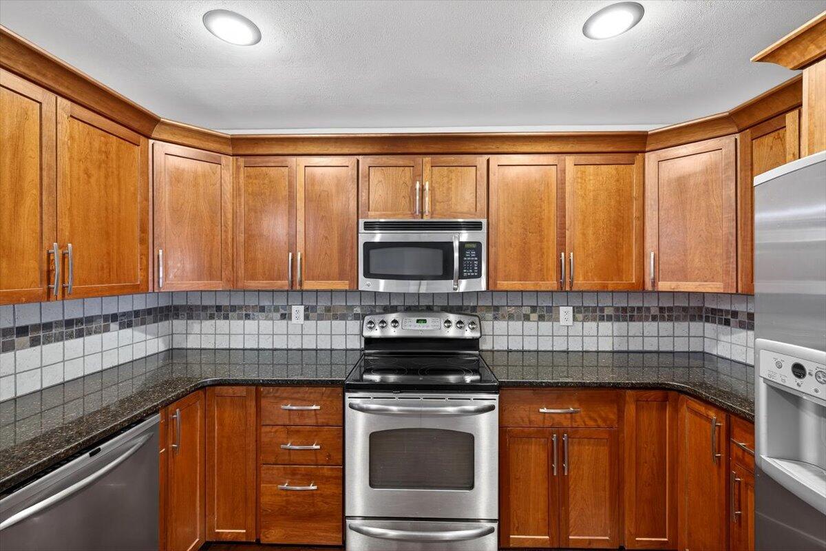 608 Northview Drive Crestview, FL 32536 - Photo 16 of 39 a kitchen with stainless steel appliances a stove sink and microwave