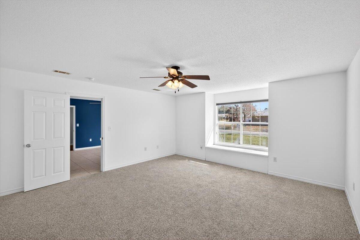 608 Northview Drive Crestview, FL 32536 - Photo 20 of 39 a view of a livingroom with a ceiling fan and window