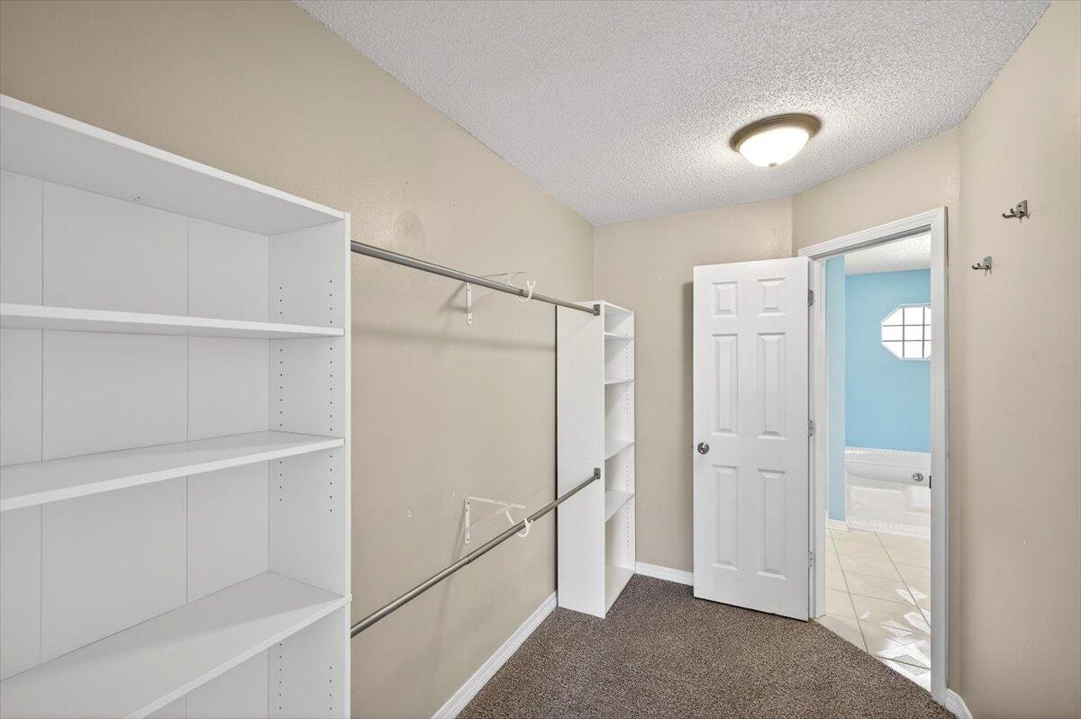 608 Northview Drive Crestview, FL 32536 - Photo 23 of 39 a view of walk in closet with empty racks