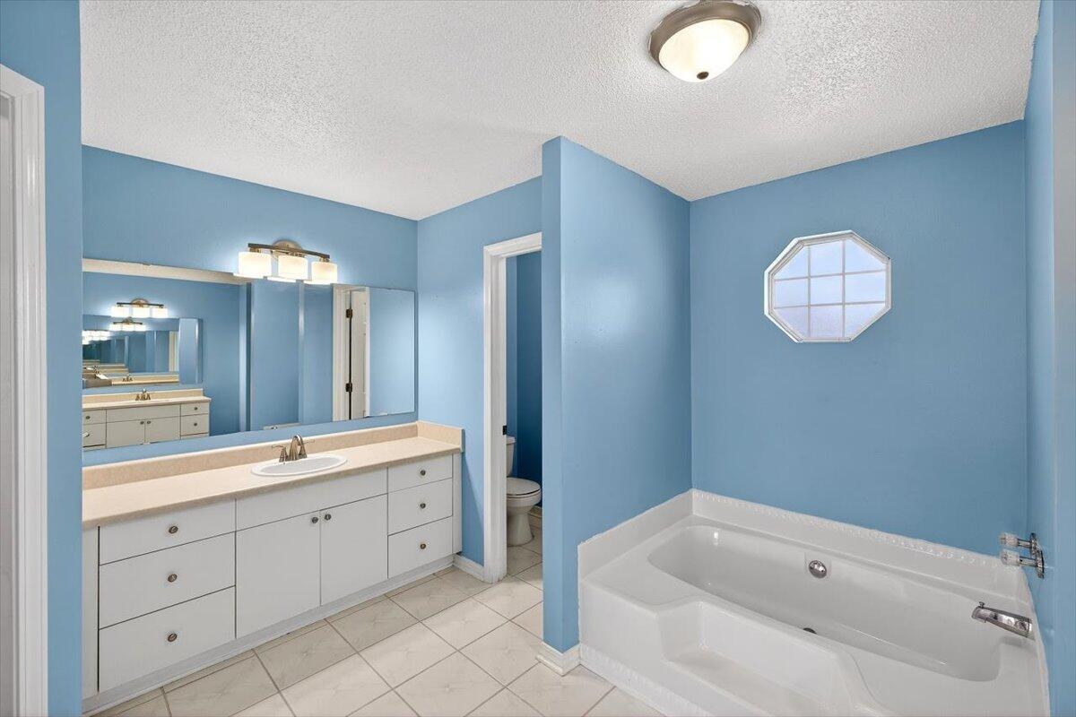 608 Northview Drive Crestview, FL 32536 - Photo 26 of 39 a spacious bathroom with a tub sink and mirror