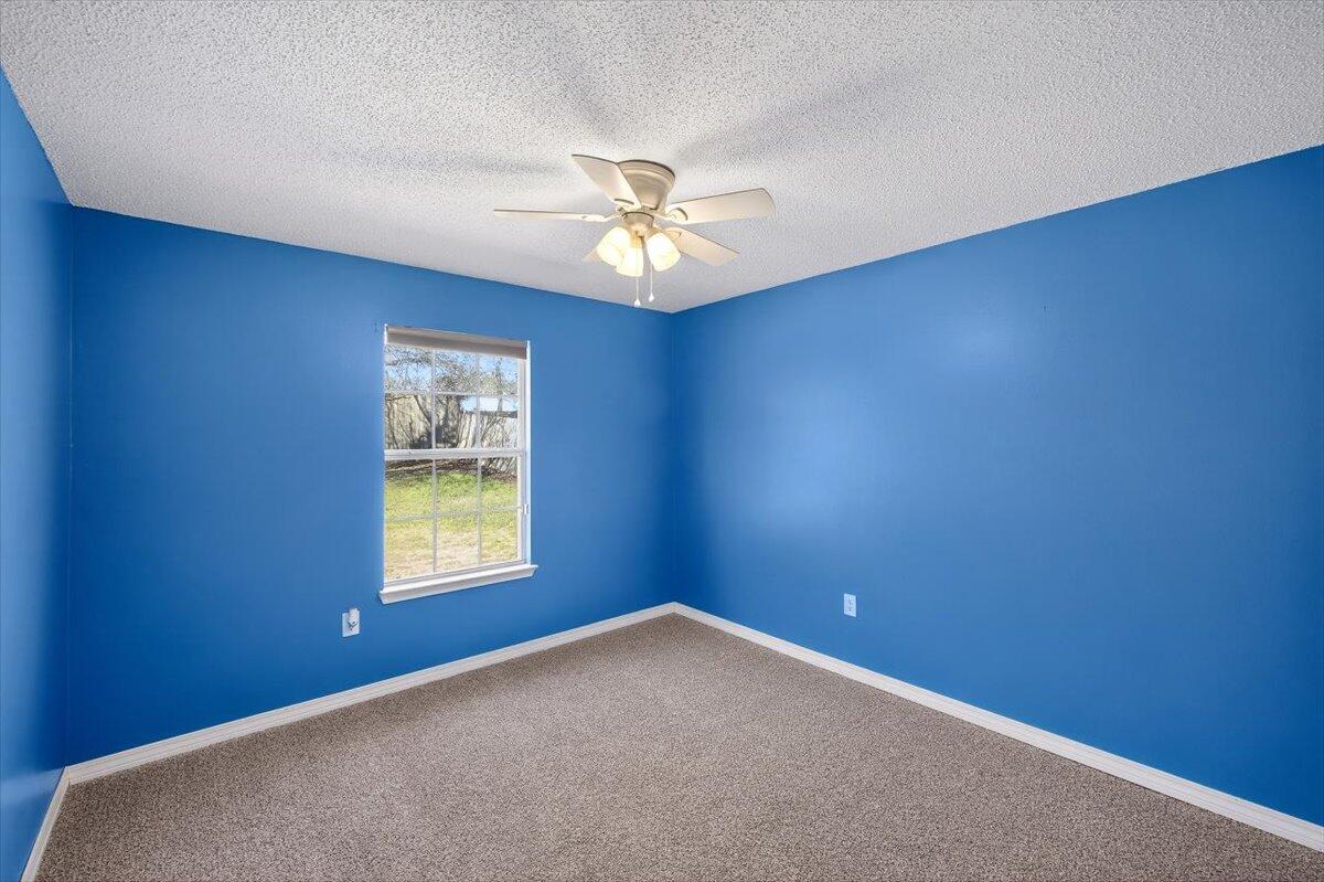 608 Northview Drive Crestview, FL 32536 - Photo 31 of 39 an empty room with a window and a fan