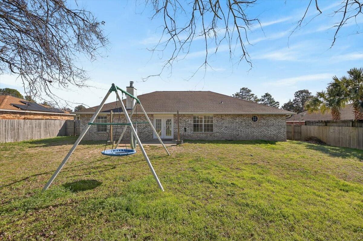 608 Northview Drive Crestview, FL 32536 - Photo 36 of 39 a view of a backyard with a table and chairs