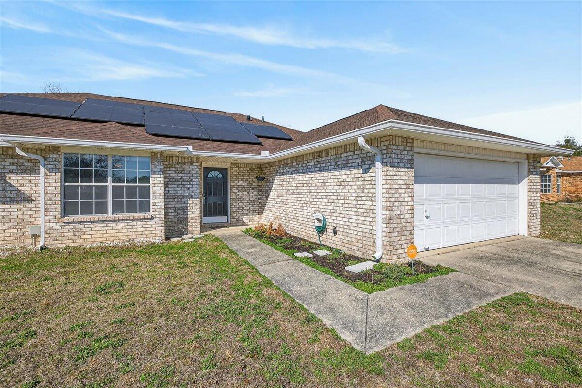 608 Northview Drive Crestview, FL 32536 - Photo 4 of 39 a front view of a house with garden