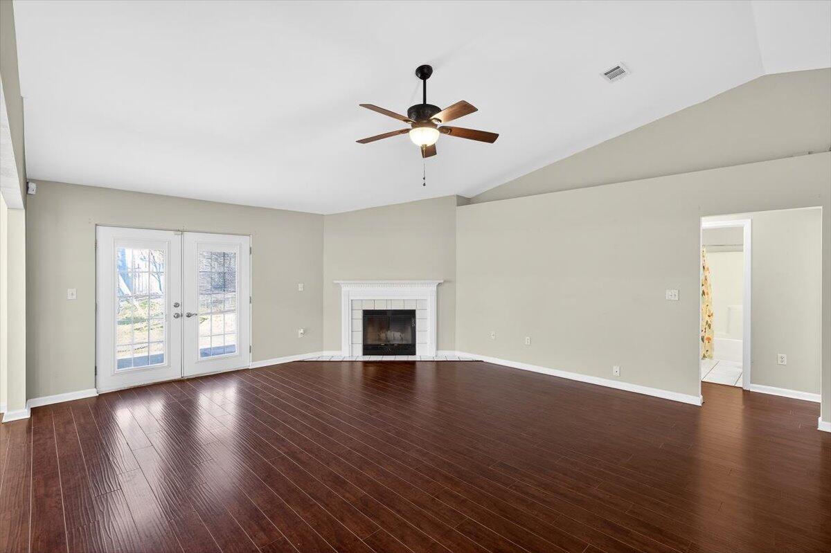 608 Northview Drive Crestview, FL 32536 - Photo 6 of 39 a view of an empty room with wooden floor and a window