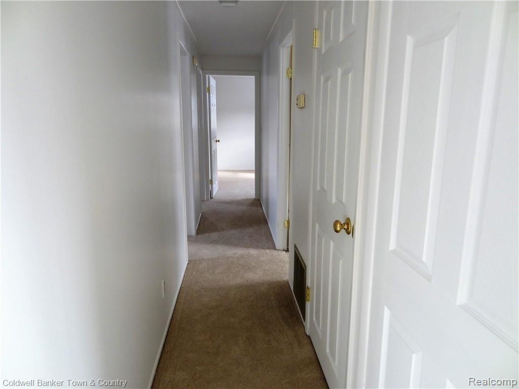 4651 Maybee Road Clarkston, MI 48348 - Photo 12 of 45 Hallway from living space to bedrooms...fresh paint all around.