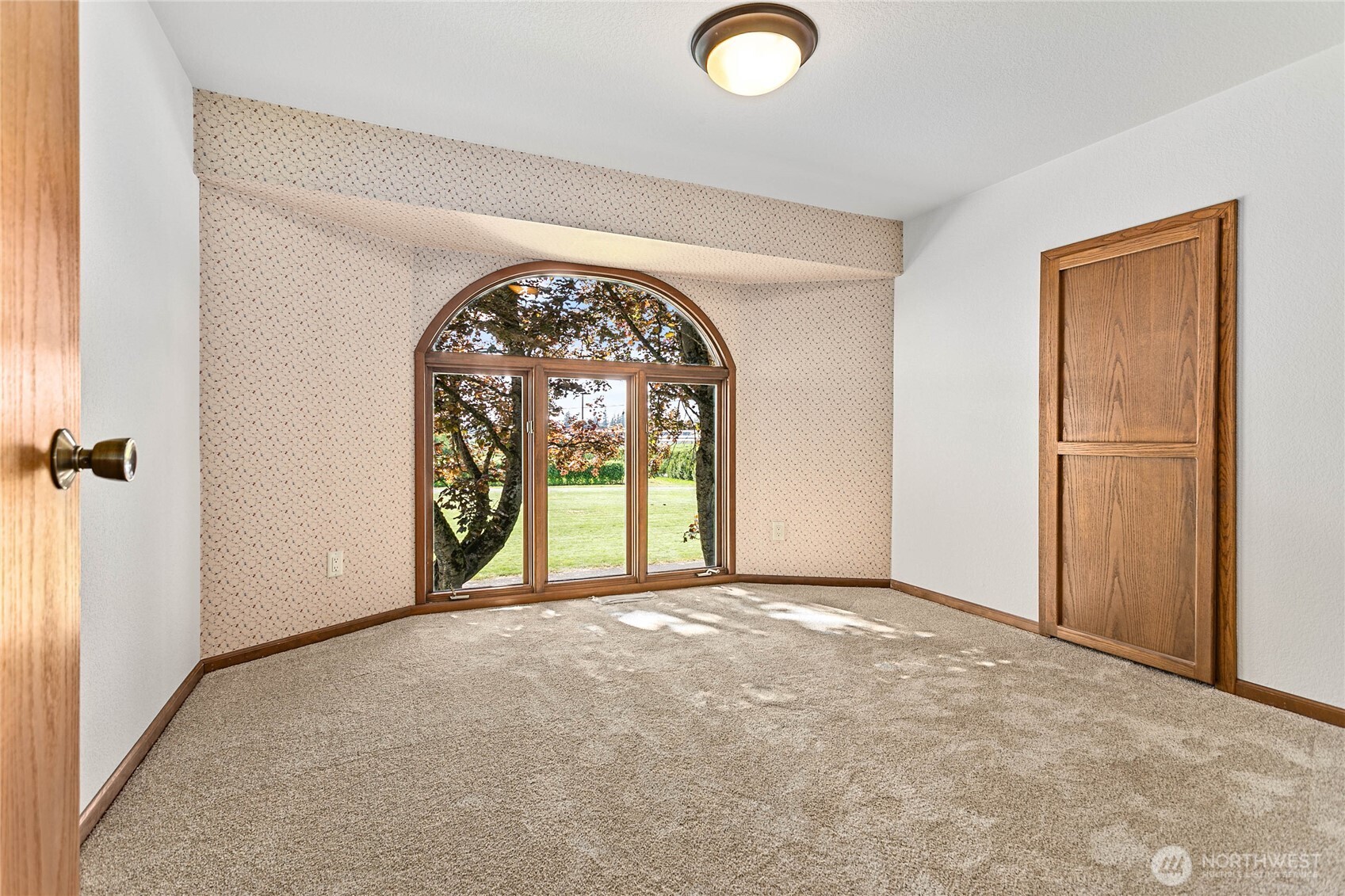 1133 East Pole Road Everson, WA 98247 - Photo 26 of 40 an empty room with windows and glass door