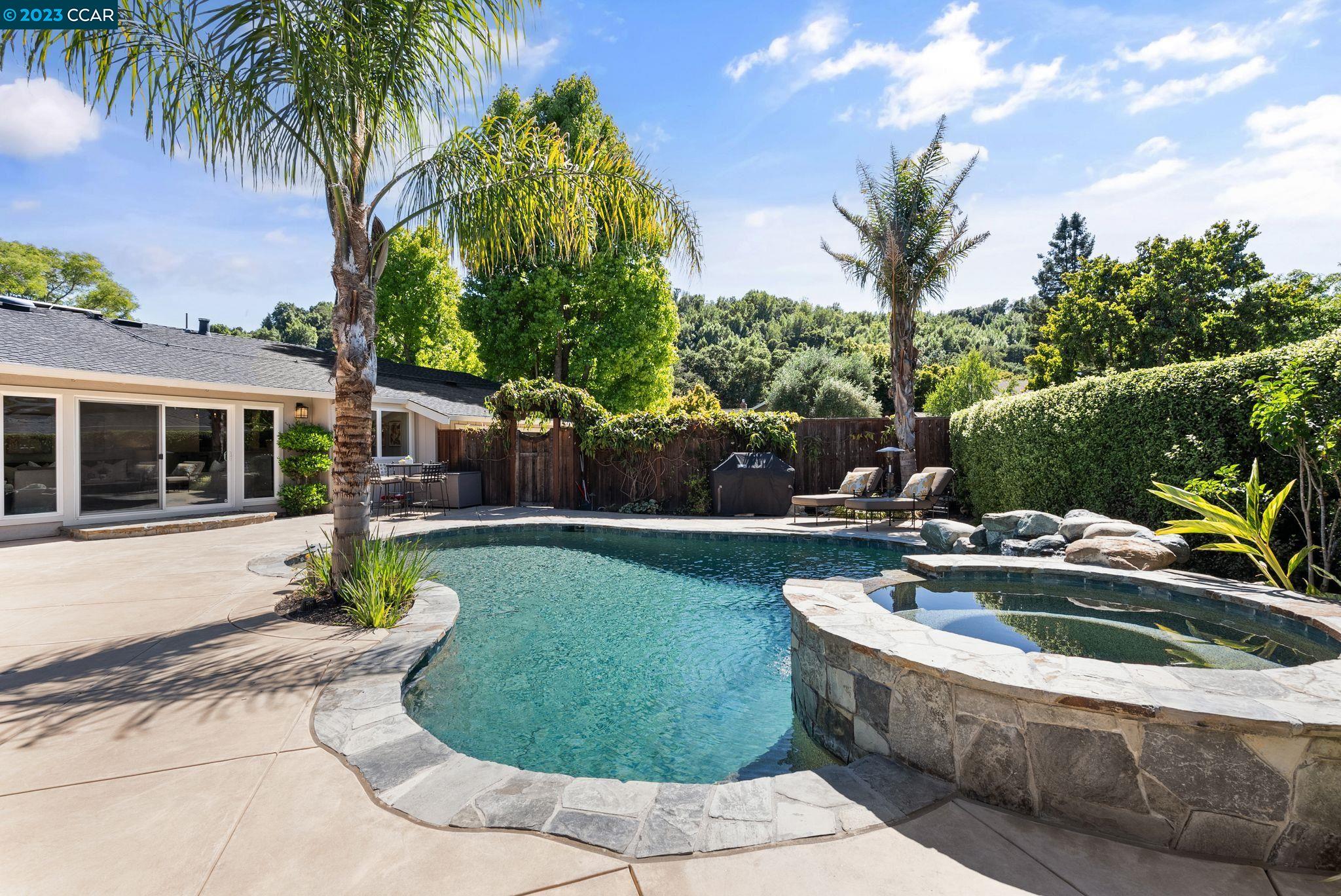 a view of a swimming pool with a patio