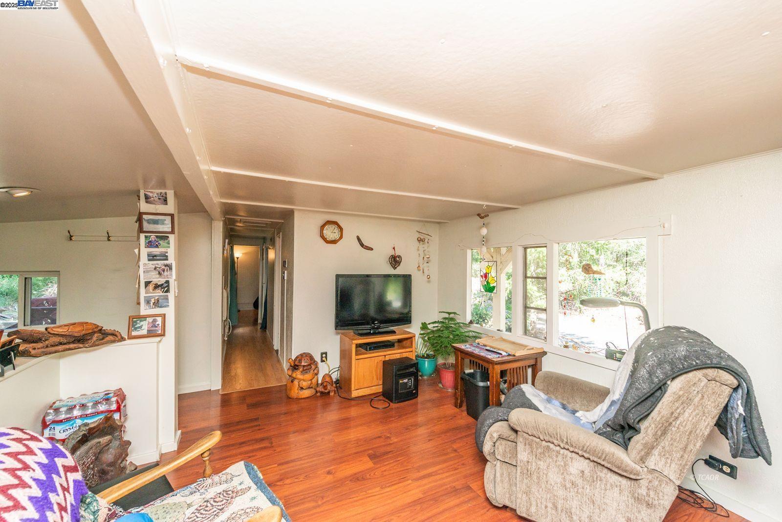 2940 Dutch Creek Road Junction City, CA 96048 - Photo 13 of 47 a living room with furniture and a flat screen tv