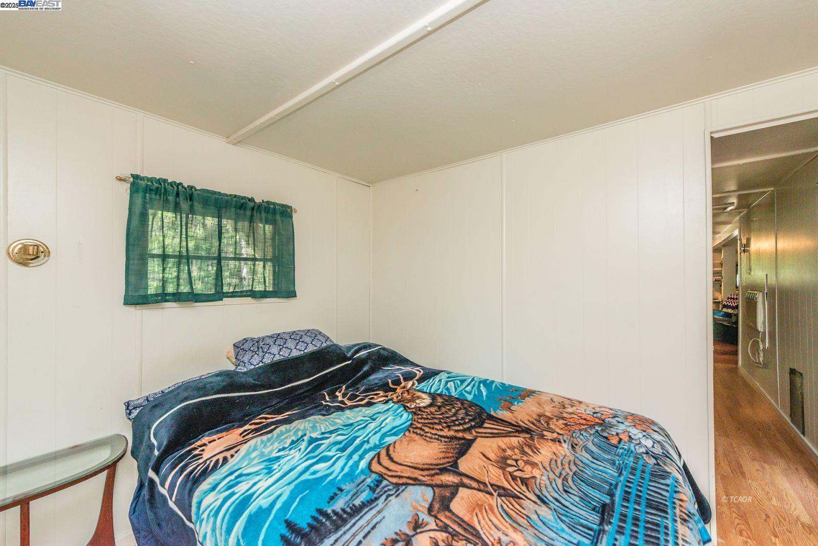 2940 Dutch Creek Road Junction City, CA 96048 - Photo 19 of 47 a bedroom with a bed and a window
