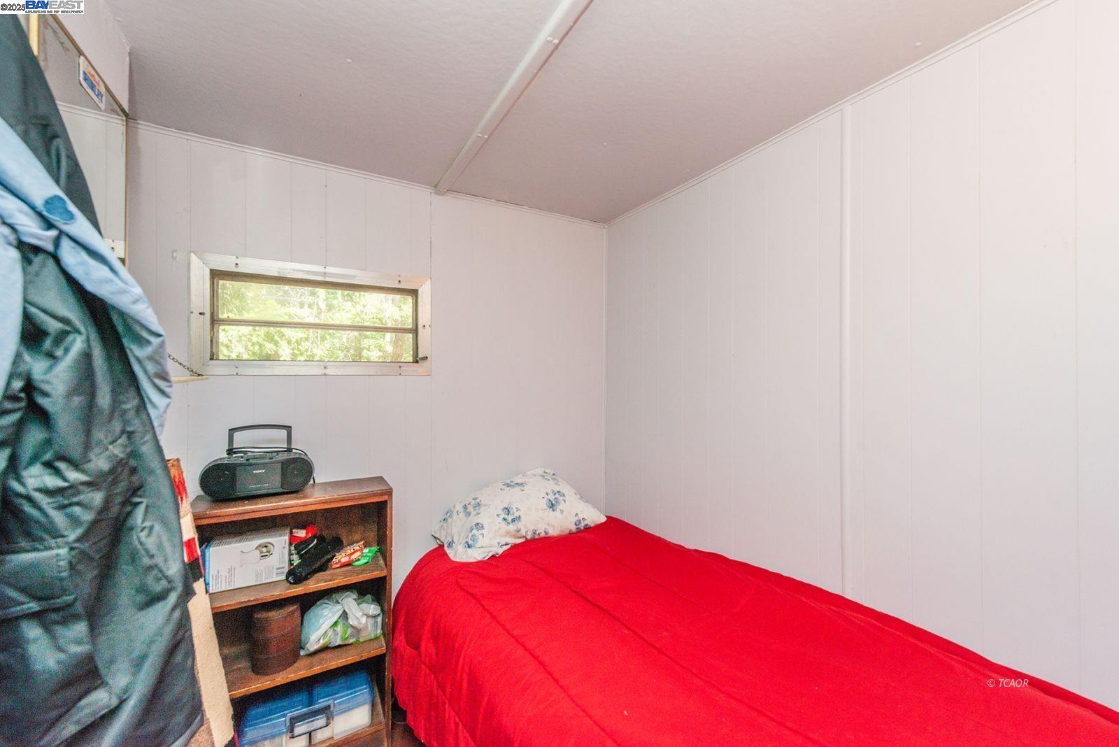 2940 Dutch Creek Road Junction City, CA 96048 - Photo 20 of 47 a bedroom with a bed and a window