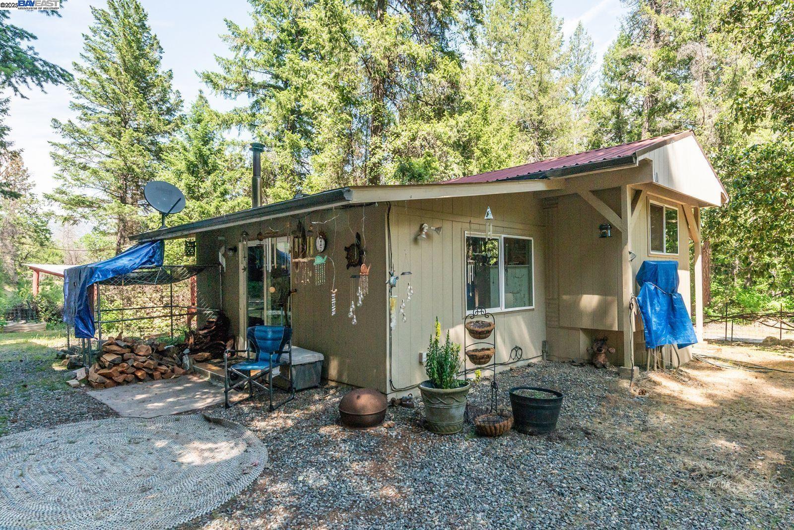 2940 Dutch Creek Road Junction City, CA 96048 - Photo 25 of 47 a view of a house with backyard stove and sitting area