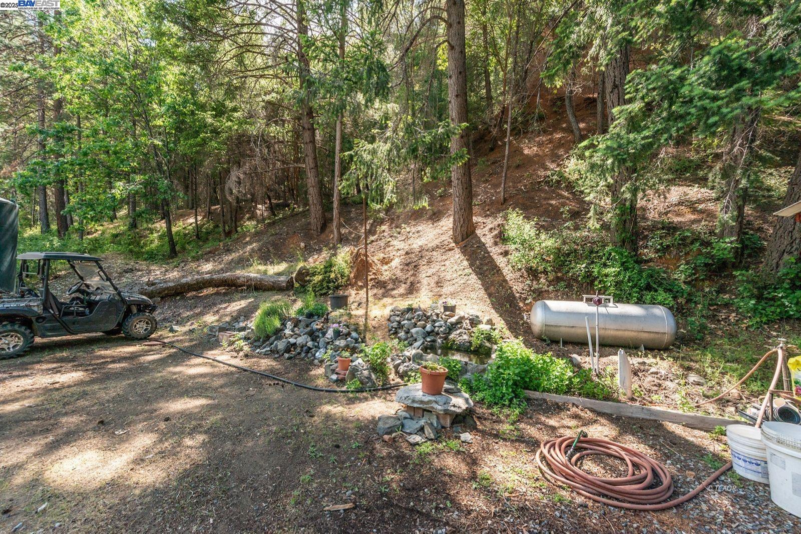 2940 Dutch Creek Road Junction City, CA 96048 - Photo 28 of 47 a view of a chair and table in the backyard