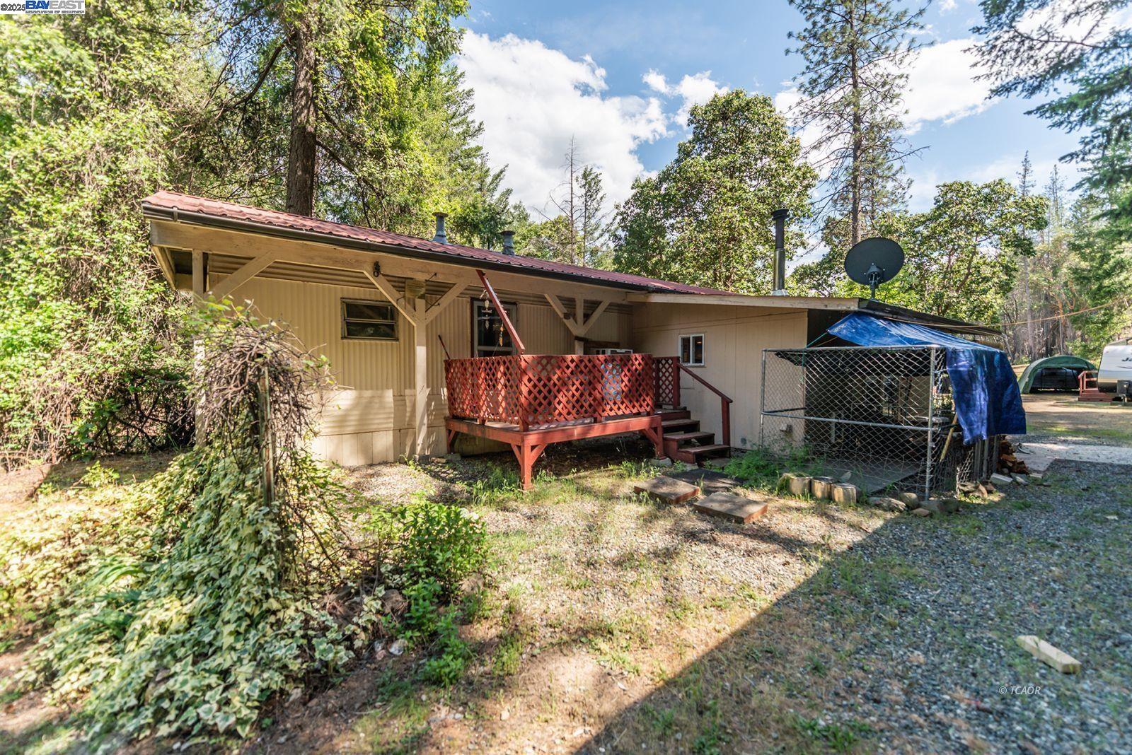 2940 Dutch Creek Road Junction City, CA 96048 - Photo 35 of 47 a view of house with backyard and sitting area
