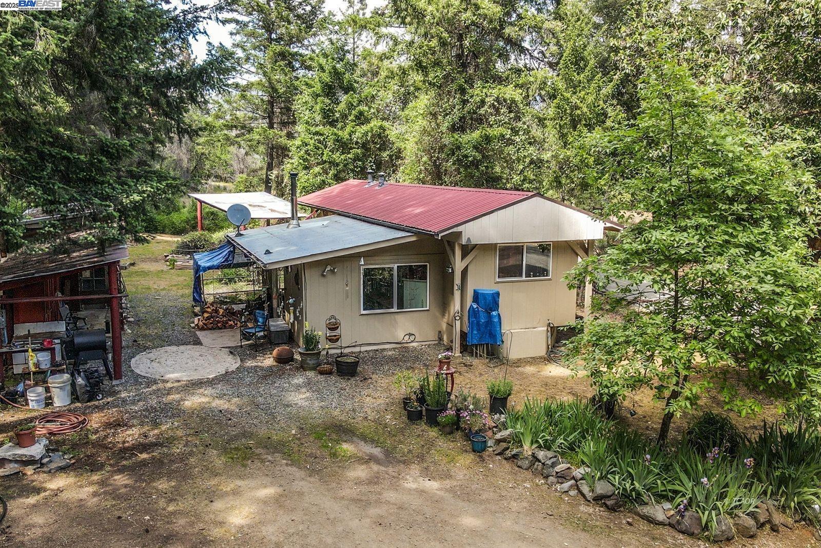 2940 Dutch Creek Road Junction City, CA 96048 - Photo 5 of 47 a view of a patio with chairs and a small yard