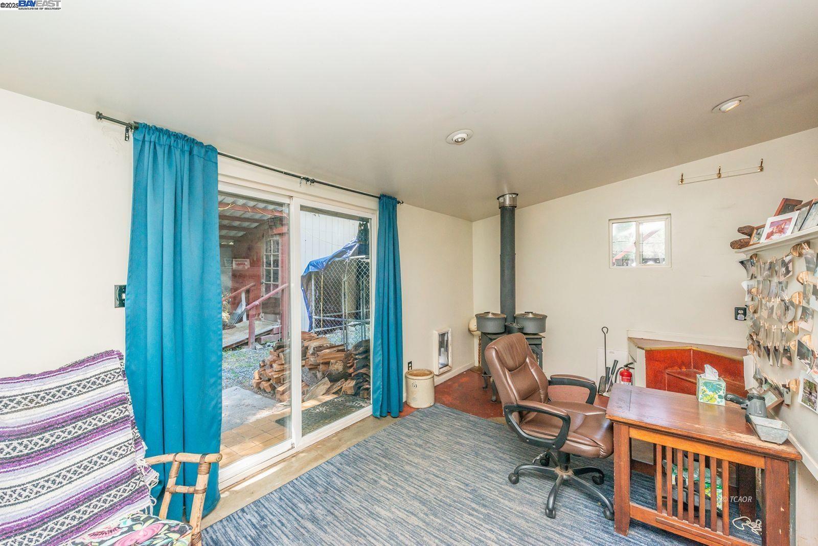 2940 Dutch Creek Road Junction City, CA 96048 - Photo 7 of 47 a living room with furniture and a floor to ceiling window