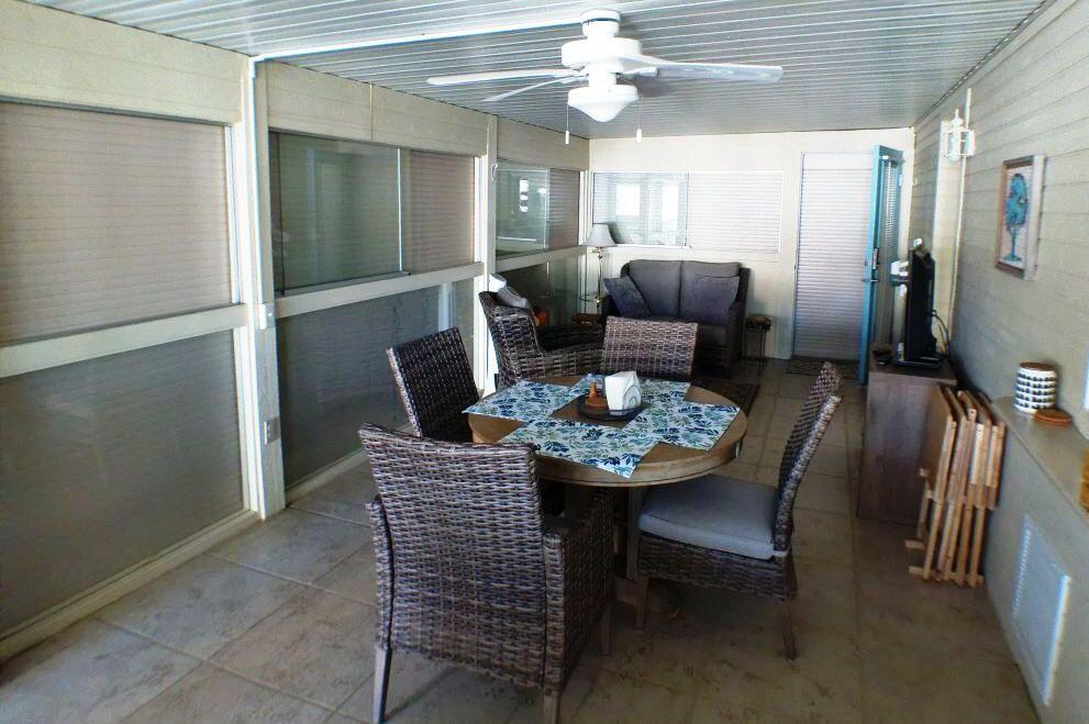84136 Ave 44, Unit 408 Indio, CA 92203 - Photo 16 of 44 a dining room with furniture and window