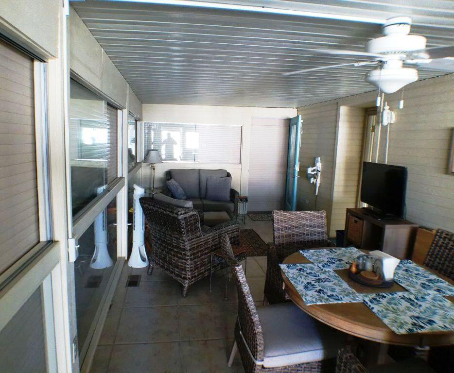 84136 Ave 44, Unit 408 Indio, CA 92203 - Photo 19 of 44 a living room with furniture and a flat screen tv