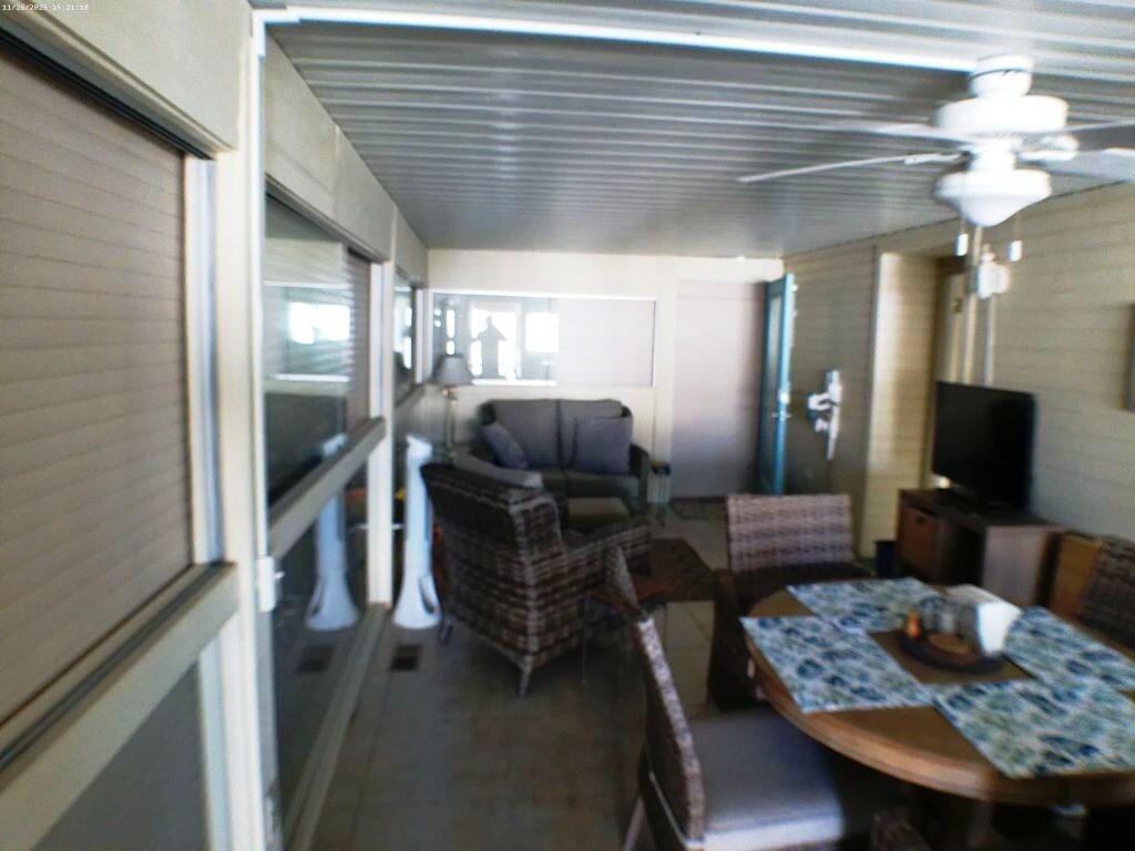 84136 Ave 44, Unit 408 Indio, CA 92203 - Photo 20 of 44 a living room with furniture and a chandelier