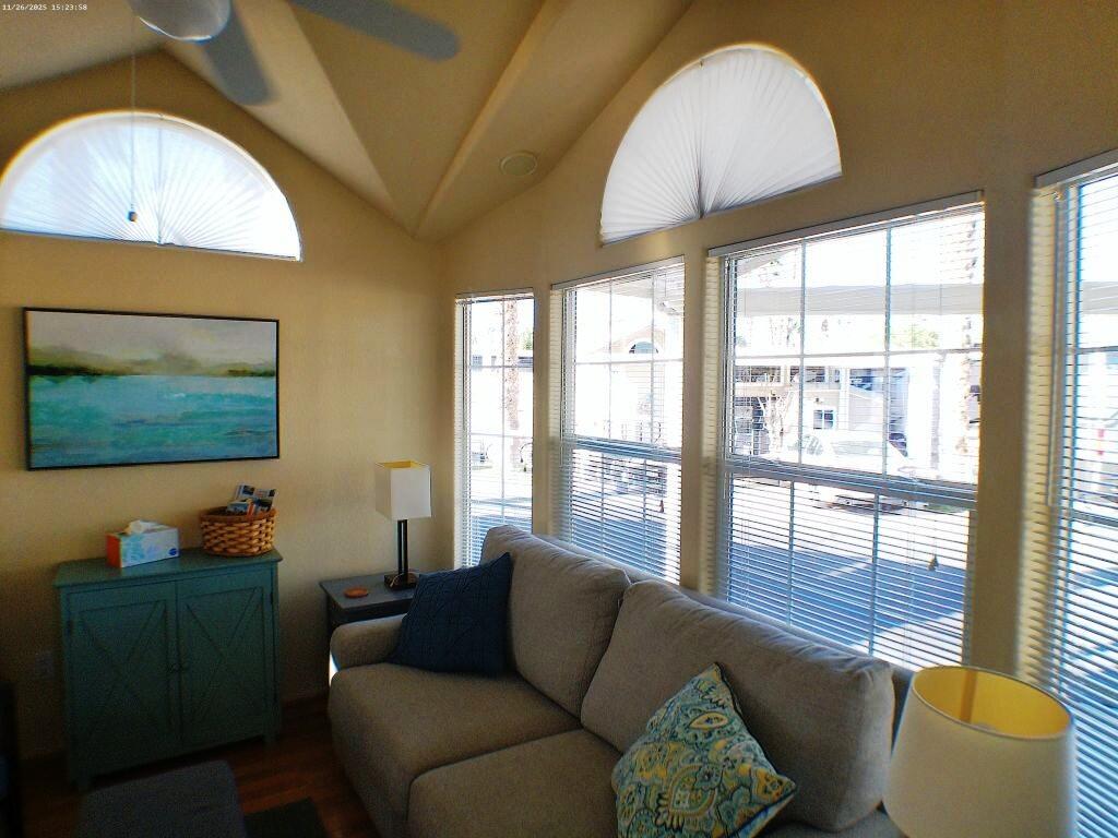 84136 Ave 44, Unit 408 Indio, CA 92203 - Photo 26 of 44 a living room with furniture and a flat screen tv